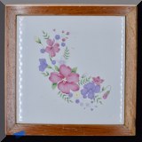 K28. Floral ceramic trivet with wood border. - $8 